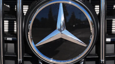 The company logo is shown on the grille of an unsold 2026 AMG S63 Performance model on the lot of a Mercedes Benz dealership Nov. 2, 2025, in Littleton, Colo.