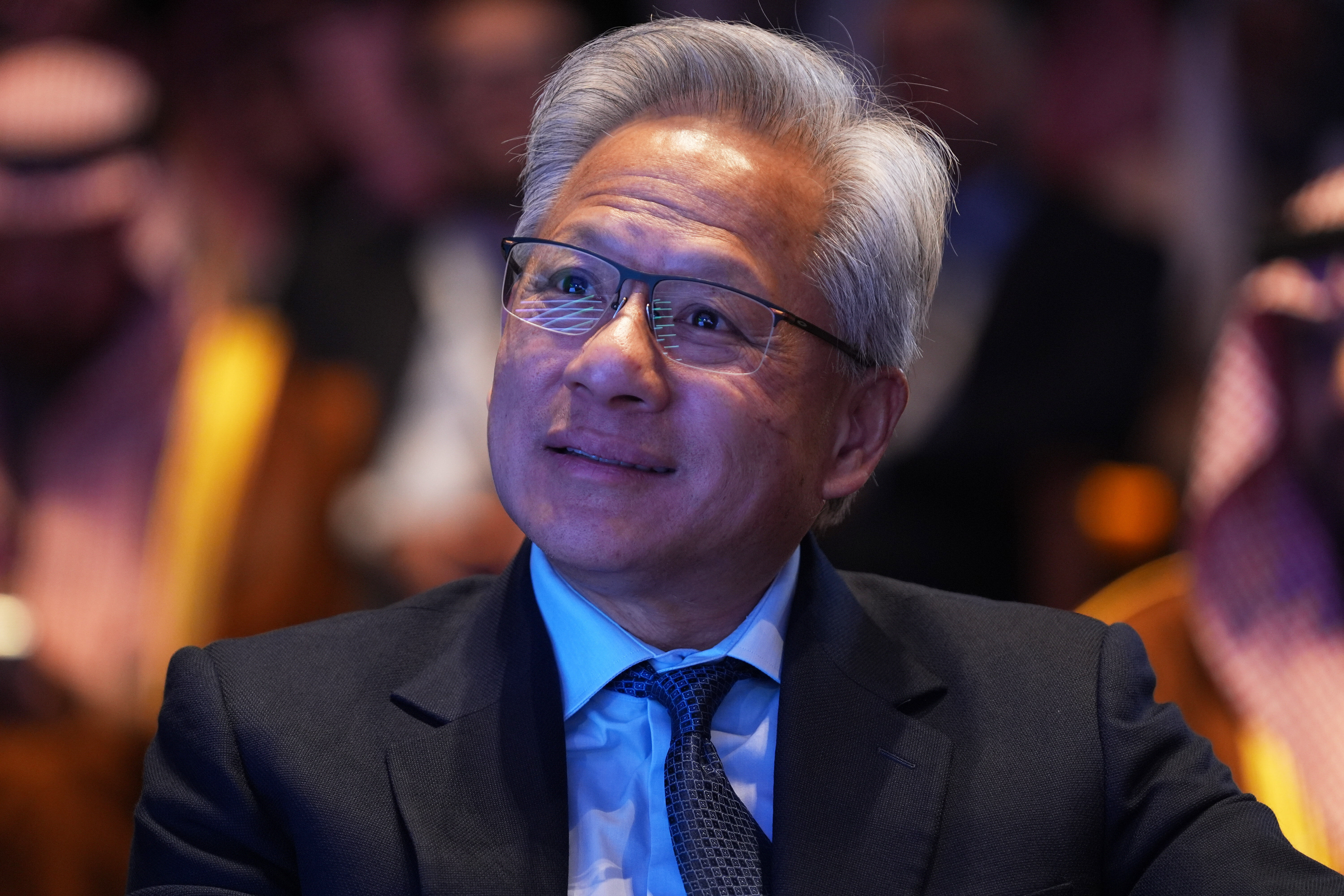 Nvidia CEO Jensen Huang listens as President Donald Trump speaks during the Saudi Investment Forum at the Kennedy Center, Wednesday, Nov. 19, 2025, in Washington.
