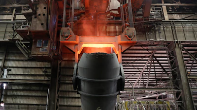 A giant ladle glows red after pouring molten iron in to a vessel inside the basic oxygen furnace as part of the processes of making steel at the U.S. Steel Granite City Works facility Thursday, June 28, 2018, in Granite City, Ill.