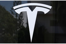 The Tesla logo is displayed at a Tesla dealership Thursday, Mar. 13, 2025, in Miami.