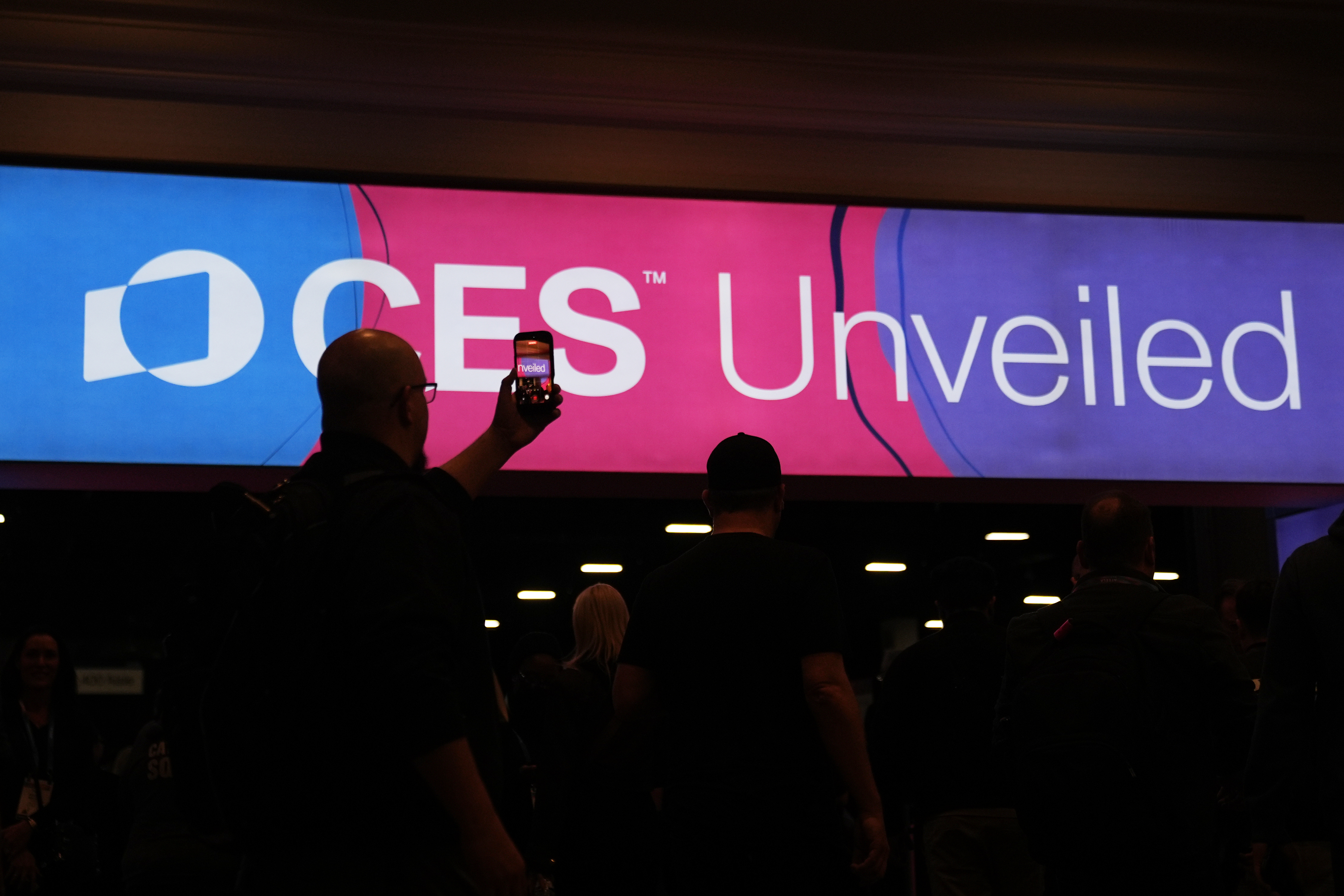 People arrive at the CES Unveiled tech show Sunday, Jan. 4, 2026, in Las Vegas.
