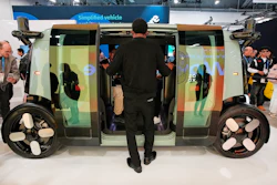 A man looks through the doors of a Zoox vehicle during the CES tech show Tuesday, Jan. 6, 2026, in Las Vegas.