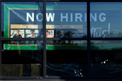 A hiring sign is displayed at a grocery store in Northbrook, Ill., Jan. 21, 2025.