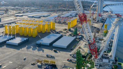 Wind turbine bases, generators and blades sit along with support ships at The Portsmouth Marine terminal that is the staging area for Dominion Energy Virginia, which is developing Coastal Virginia Offshore Wind, Dec. 22, 2025, in Portsmouth, Va.
