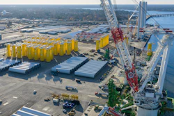 Wind turbine bases, generators and blades sit along with support ships at The Portsmouth Marine terminal that is the staging area for Dominion Energy Virginia, which is developing Coastal Virginia Offshore Wind, Dec. 22, 2025, in Portsmouth, Va.