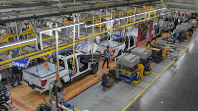 Employees work on the assembly line at the Ford River Rogue complex, Tuesday, Jan. 13, 2026, in Dearborn, Mich.