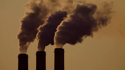 Emissions rise from the smokestacks at the Jeffrey Energy Center coal power plant as the suns sets, near Emmett, Kansas, Sept. 18, 2021.