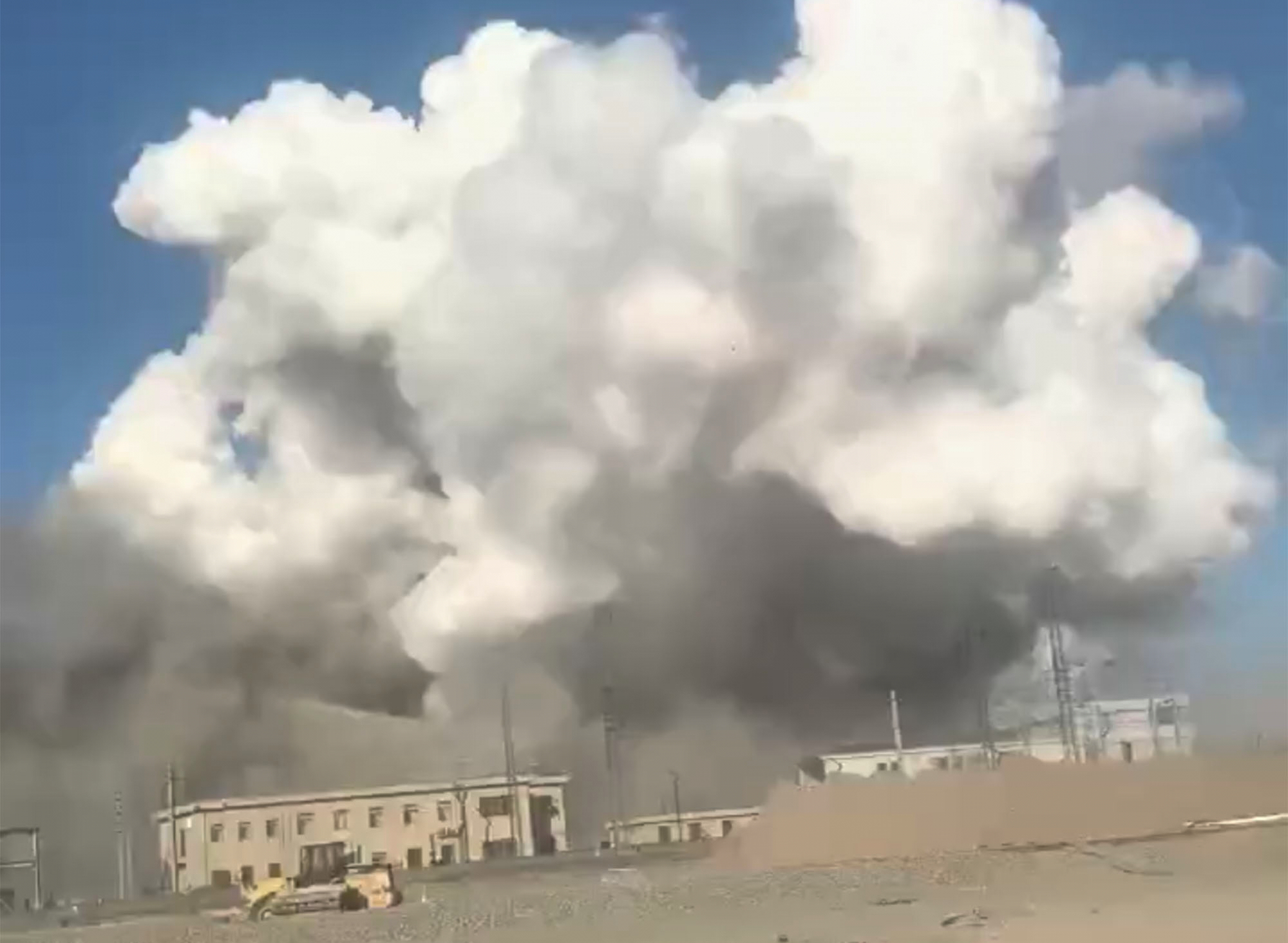 In this photo released by Xinhua News Agency, smoke rises from the site of explosions from a factory in Baotou, in north China's Inner Mongolia Autonomous Region, Sunday, Jan. 18, 2026.