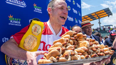 Joey Chestnut, winner of the 2021 Nathan's Famous Fourth of July International Hot Dog-Eating Contest, poses for photos in Coney Island's Maimonides Park, July 4, 2021, in the Brooklyn borough of New York.