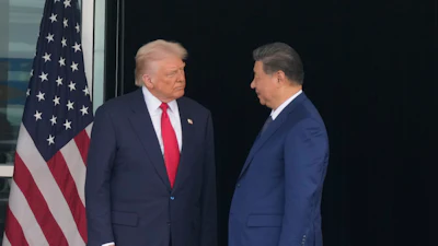 President Donald Trump, left, and Chinese President Xi Jinping, look at each other after their summit meeting at Gimhae International Airport Jinping in Busan, South Korea, Oct. 30, 2025.