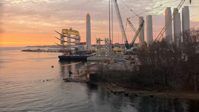 Blades and turbine bases for offshore wind sit at a staging area at New London State Pier, Wednesday, Jan. 14, 2026, in New London, Conn.