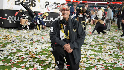 Noah Winter, responsible for the confetti displays, poses for a picture after the College Football Playoff national championship game, Monday, Jan. 19, 2026, in Miami Gardens, Fla.