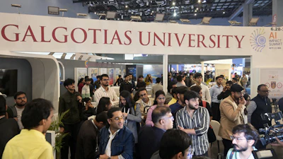 People visit Galgotias University stall at AI summit ahead of an eviction order issued by Indian authorities, in New Delhi, India, Wednesday, Feb. 18, 2026.