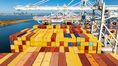Cargo containers line a ship at the Port of Oakland, Oakland, Calif., Aug. 6, 2025.