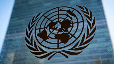 The symbol of the United Nations is displayed outside the Secretariat Building, Feb. 28, 2022, at United Nations Headquarters.