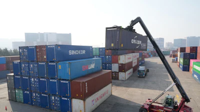 A crane unloads a container at the Uiwang ICD Terminal in Uiwang, South Korea, Thursday, March 12, 2026.