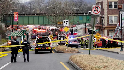 Emergency personnel work at the site of a deadly explosion at a chocolate factory in West Reading, Pa., on March 25, 2023.