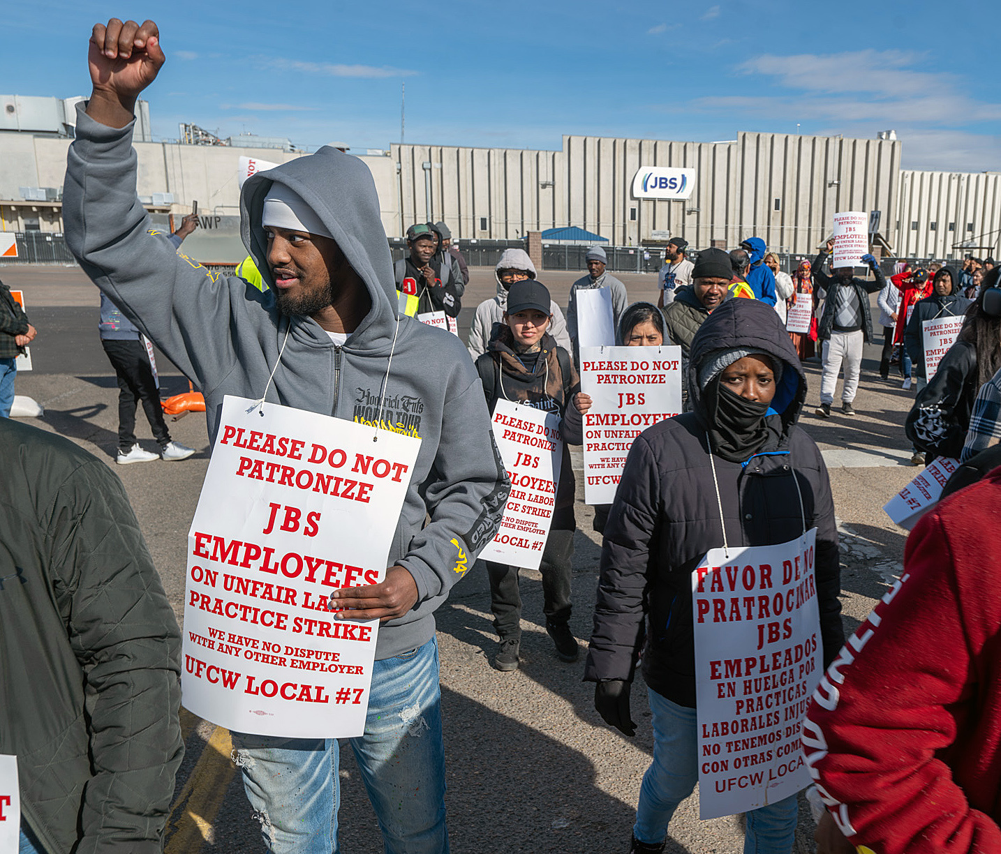 Workers from the JBS Beef Plant protest across the road from the plant on March 16, 2026 in Greeley, Colo.