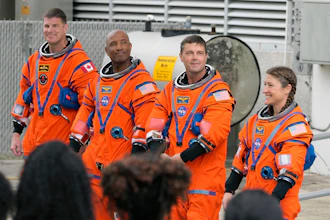 Astronauts, from left, Mission Specialist Jeremy Hansen, of Canada, Pilot Victor Glover, Commander Reid Wiseman, and Mission Specialist Christina Koch pose for a photo after leaving the Operations and Checkout Building for a trip to Launch Pad 39-B and a planned liftoff on NASA's Artemis II moon rocket at the Kennedy Space Center Wednesday, April 1, 2026, in Cape Canaveral, Fla.