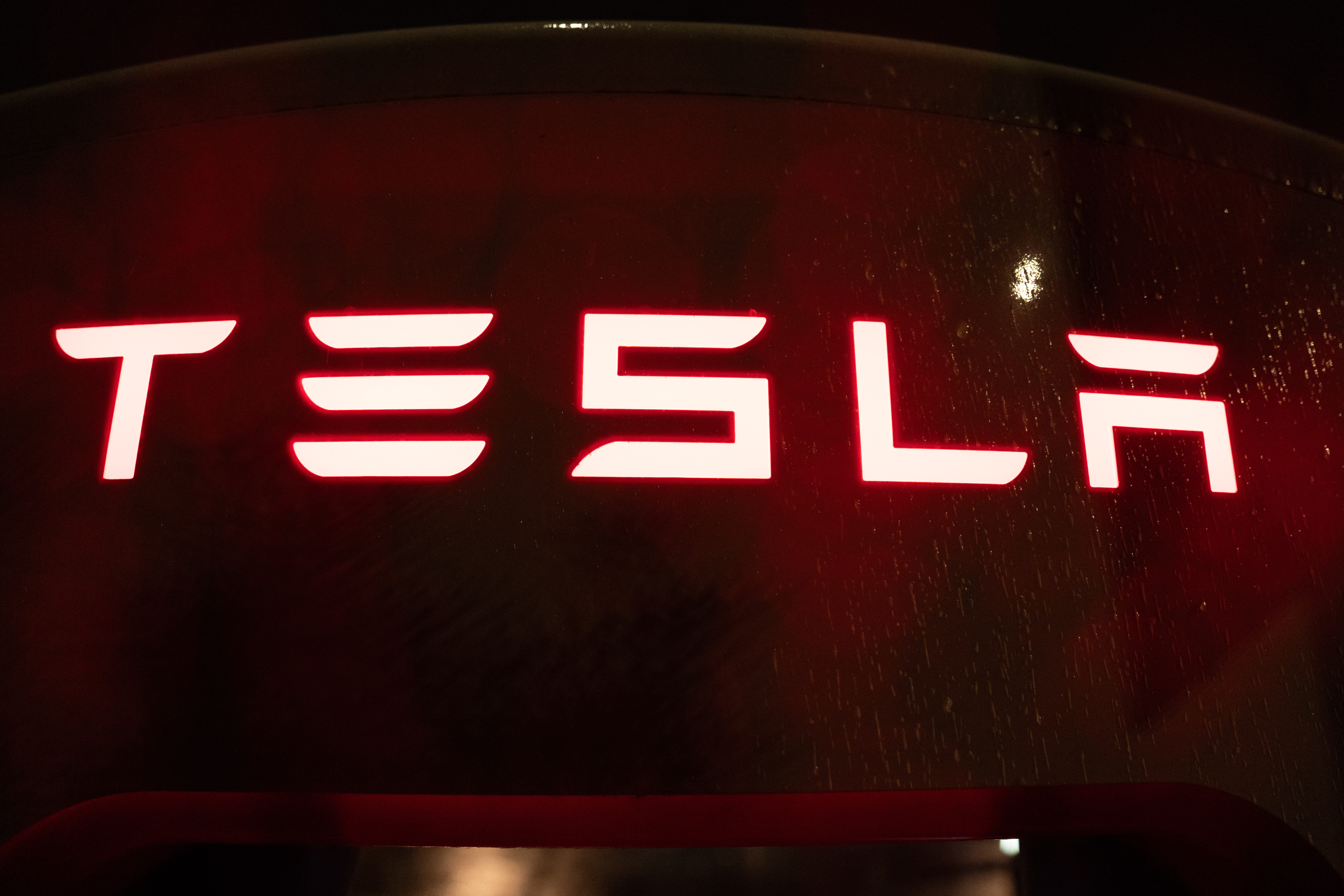 A Tesla electric vehicle charger is seen at a charging station on Wednesday, April 15, 2026, in Portland, Ore.