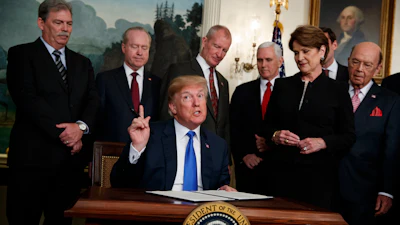 President Donald Trump speaks before he signs a presidential memorandum imposing tariffs and investment restrictions on China in the Diplomatic Reception Room of the White House, March 22, 2018, in Washington.