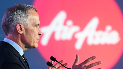 Canada's Prime Minister Mark Carney speaks during an event at the Airbus A220 Delivery Center in Mirabel, Que., Wednesday, May 6, 2026, where AirAsia placed a landmark order for 150 Airbus A220 aircraft.