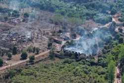 This photo released by Xinhua News Agency, this aerial drone photo taken May 5, 2026 shows rescuers working on site after an explosion at a fireworks plant in Guandu Town of Liuyang, central China's Hunan Province.