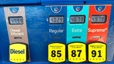 The per-gallon price is displayed electronically above the grades of gasoline available from a pump at an Exxon gasoline station in Litttleton, Colo., Tuesday, May 12, 2026.