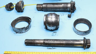 This photo released by the National Transportation Safety Board (NTSB) on Nov. 20, 2025, shows the spherical bearing and other pieces of the damaged mount of the engine that flew off a UPS cargo plane in Louisville, Ky., on Nov. 4, 2025.