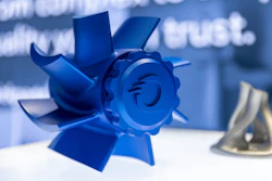 A blue CNC part created by Quickparts.
