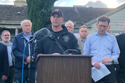 Longview Fire Department Battalion Chief Matt Amos speaks at a press conference in Longview, Wash., Tuesday, May 26, 2026, at the site of a paper mill where a chemical tank failure killed at least one person and left others unaccounted for.