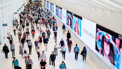 Commuters walk through a corridor in the World Trade Center Transportation Hub in New York on June 21, 2019.