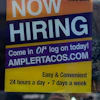 A hiring sign is displayed at a restaurant in Niles, Ill., Thursday, May 14, 2026.