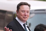 Elon Musk departs after a welcome ceremony with President Donald Trump and China's President Xi Jinping at the Great Hall of the People, Thursday, May 14, 2026, in Beijing.