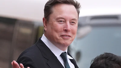Elon Musk departs after a welcome ceremony with President Donald Trump and China's President Xi Jinping at the Great Hall of the People, May 14, 2026, Beijing.