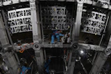 Workers labor on the underside of the cosmic detector housed underground at the Jiangmen Underground Neutrino Observatory in Kaiping in southern China's Guangdong province, Oct. 11, 2024.