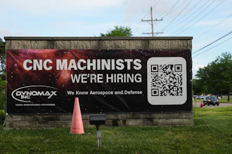 A hiring sign is seen outside of a company in Wheeling, Ill., Monday, June 8, 2026.