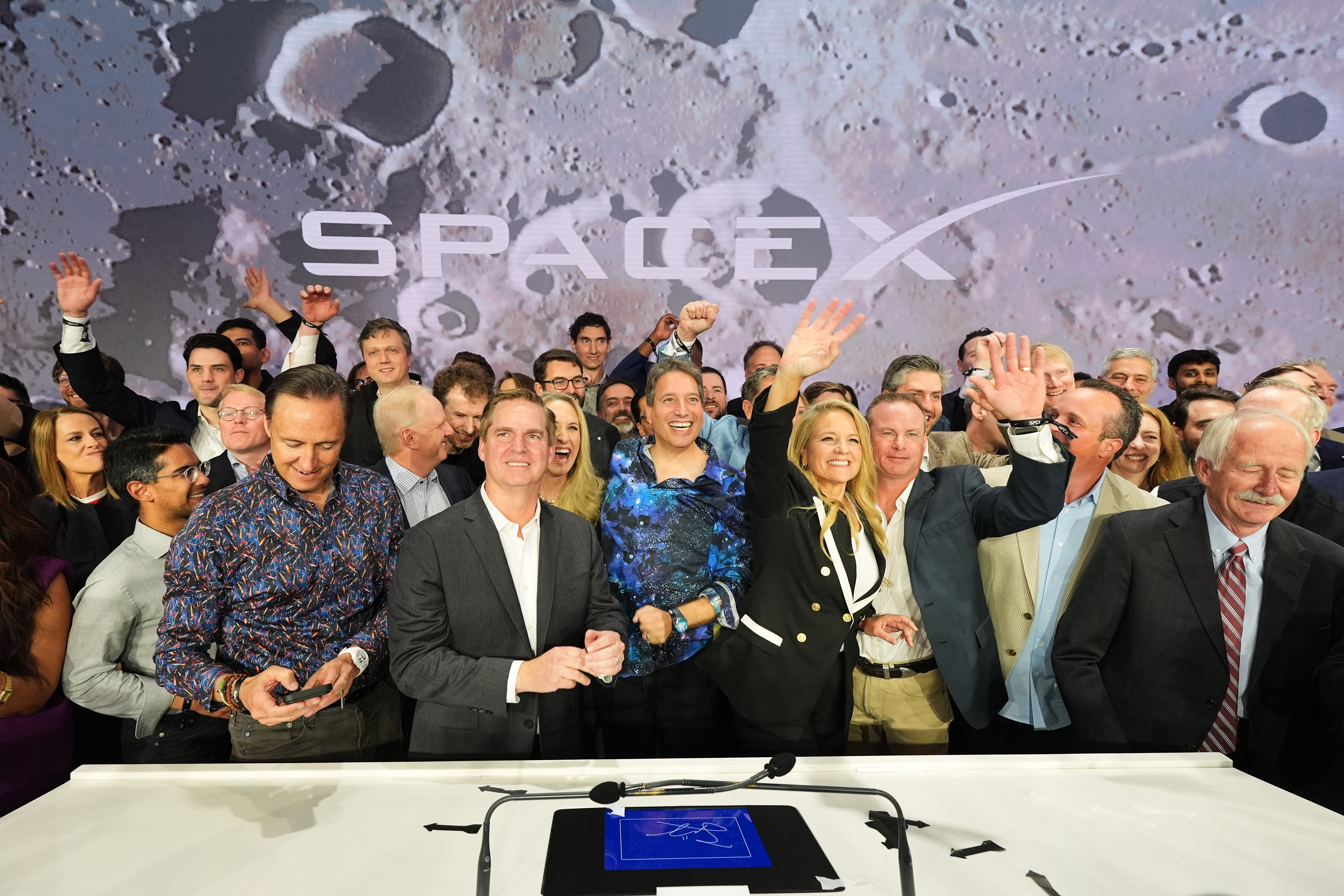 Gwynne Shotwell, President and COO of SpaceX, third from right, celebrates with colleagues during a bell ringing ceremony for the IPO of SpaceX at the Nasdaq MarketSite in New York, Friday, June 12, 2026, in New York.