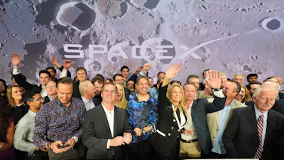 Gwynne Shotwell, President and COO of SpaceX, third from right, celebrates with colleagues during a bell ringing ceremony for the IPO of SpaceX at the Nasdaq MarketSite in New York, Friday, June 12, 2026, in New York.