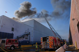 Crews work a warehouse fire in the Boyle Heights section of Los Angeles, June 17, 2026.