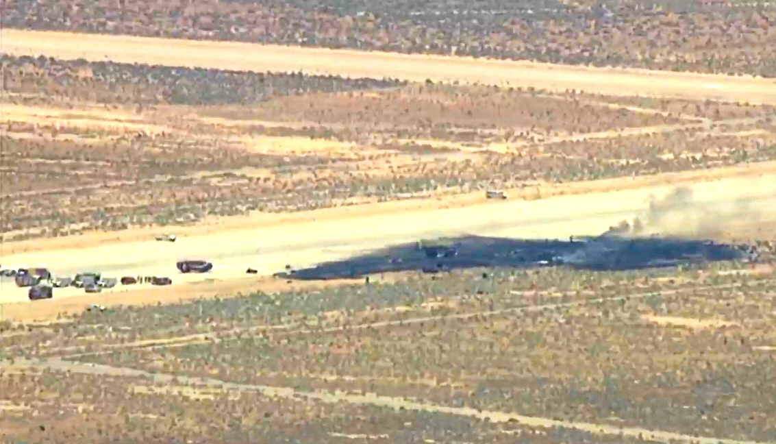 This image taken from video provided by KABC shows law enforcement responding to the scene of an aircraft crash, Monday, June 15, 2026, near Edwards Air Force Base, Calif.