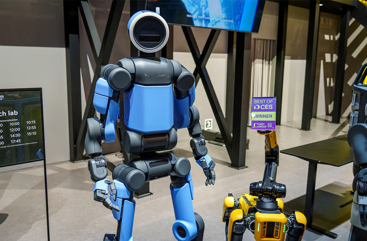 Boston Dynamics received a $25 million award to fund projects tied to manufacturing, workforce training and operations for the company&rsquo;s Atlas (left), Spot (lower right) and Stretch platforms.