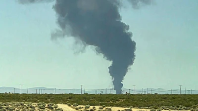 Smoke plumes rise from a B-52 bomber that crashed shortly after takeoff at a U.S. Air Force base in Southern California, Monday, June 15, 2026.