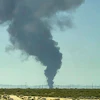 Smoke plumes rise from a B-52 bomber that crashed shortly after takeoff at a U.S. Air Force base in Southern California, Monday, June 15, 2026.