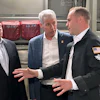 Energy Secretary Chris Wright, center, and Under Secretary of Defense Michael Duffey, left, listen as Isaiah Taylor, CEO of Valar Atomics, discusses a microreactor developed by Valar to generate nuclear power for the military and commercial customers, Feb. 15, 2026, in-flight, on board a C-17.