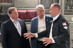 Energy Secretary Chris Wright, center, and Under Secretary of Defense Michael Duffey, left, listen as Isaiah Taylor, CEO of Valar Atomics, discusses a microreactor developed by Valar to generate nuclear power for the military and commercial customers, Feb. 15, 2026, in-flight, on board a C-17.