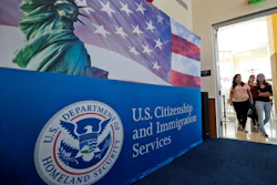 In this Aug. 17, 2018, file photo, people arrive before the start of a naturalization ceremony at the U.S. Citizenship and Immigration Services Miami Field Office in Miami.