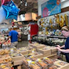 Customers shop at a grocery store in Chicago, June 25, 2026.
