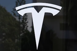 The Tesla logo is displayed at a Tesla dealership, Mar. 13, 2025, in Miami.