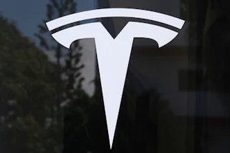 The Tesla logo is displayed at a Tesla dealership, Mar. 13, 2025, in Miami.